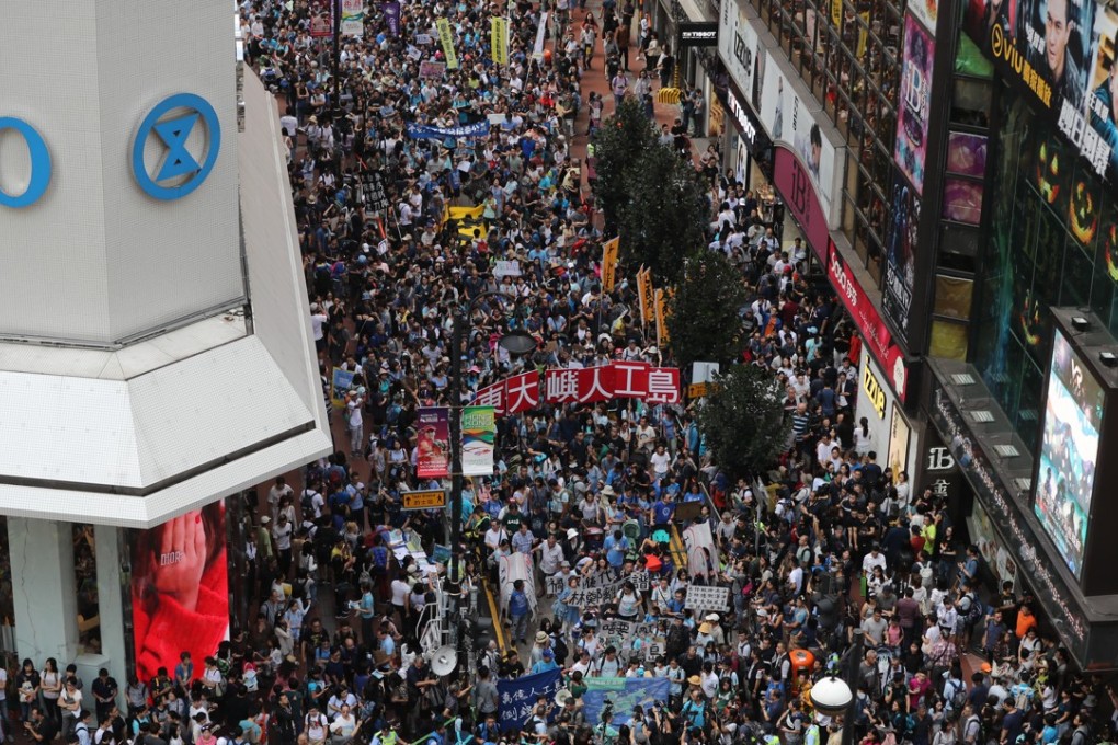 Thousands join the march to the Hong Kong government headquarters, to protest against Chief Executive Carrie Lam Cheng Yuet-ngor’s “Lantau Tomorrow Vision” reclamation project, at Causeway Bay on October 14. Demonstrators said the “white elephant” artificial island will damage the environment and only help make developers richer. Photo: Edward Wong