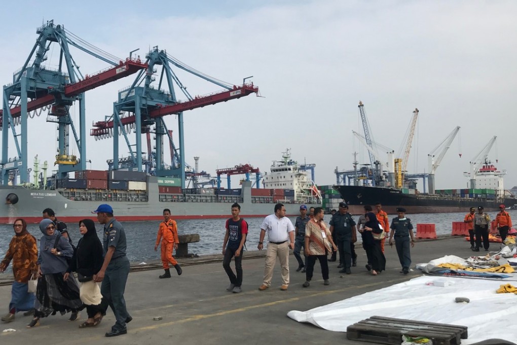 Family members of those aboard the crashed plane arrive at Tanjung Priok port to check if their loved ones’ personal belongings had been found. Photo: Resty Woro Yuniar