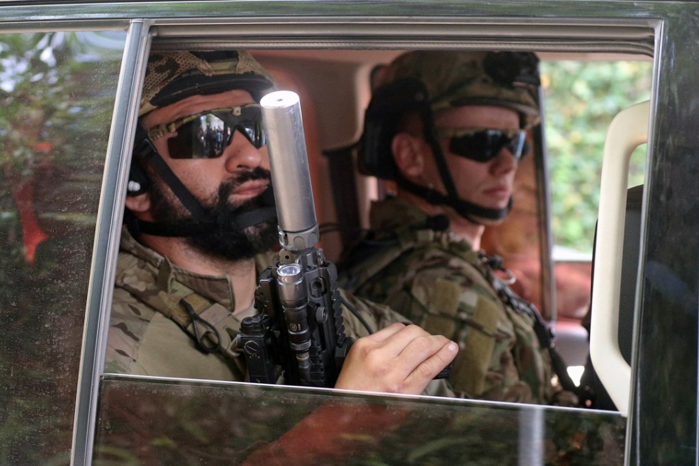 Federal Police officers outside the venue where Brazil's new President-elect Jair Bolsonaro and economist Paulo Guedes met in Rio de Janeiro, Brazil. Photo: Reuters