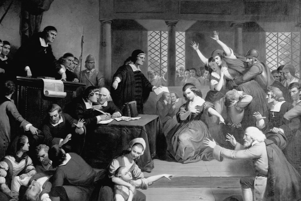 A portrayal of the 1692 witchcraft trials in Salem, Massachusetts shows George Jacobs (right) attempting to plead his innocence as young girls and townspeople in varying states of hysteria accuse him of witchcraft before a tribunal of judges
