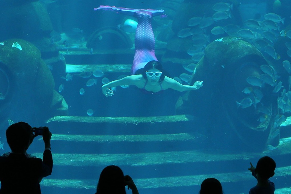 Visitors watch the mermaids’ performance inside Atlantis Sanya hotel in Sanya. The island resort in southern China comes out as the top domestic choice for well-healed Chinese to have their holiday home, in the latest Hurun lifestyle survey. Photo: SCMP / Dickson Lee