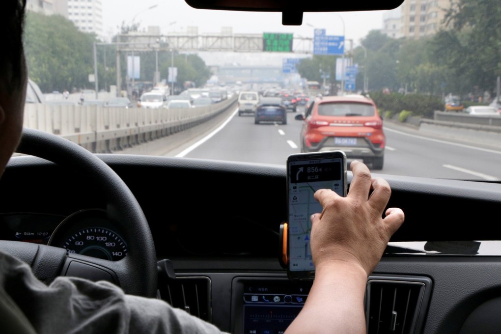 A Didi Chuxing driver on a trip in Beijing. English speakers complained that some drivers turned them down due to language barriers. Photo: Reuters