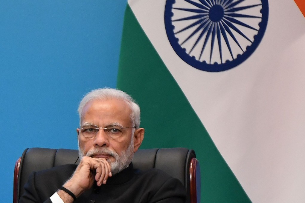 Indian Prime Minister Narendra Modi looks on as he attends a signing ceremony during the Shanghai Cooperation Organisation (SCO) Summit in Qingdao, China. India has lodged a protest against a bus route proposed between Pakistan and China. Photo: AFP