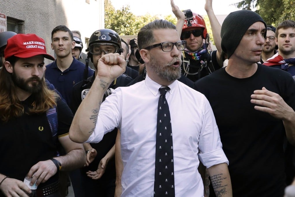 In this April 27, 2017 file photo, Gavin McInnes, centre, founder of the far-right group Proud Boys, is surrounded by supporters after speaking at a rally in Berkeley, California. Photo: AP