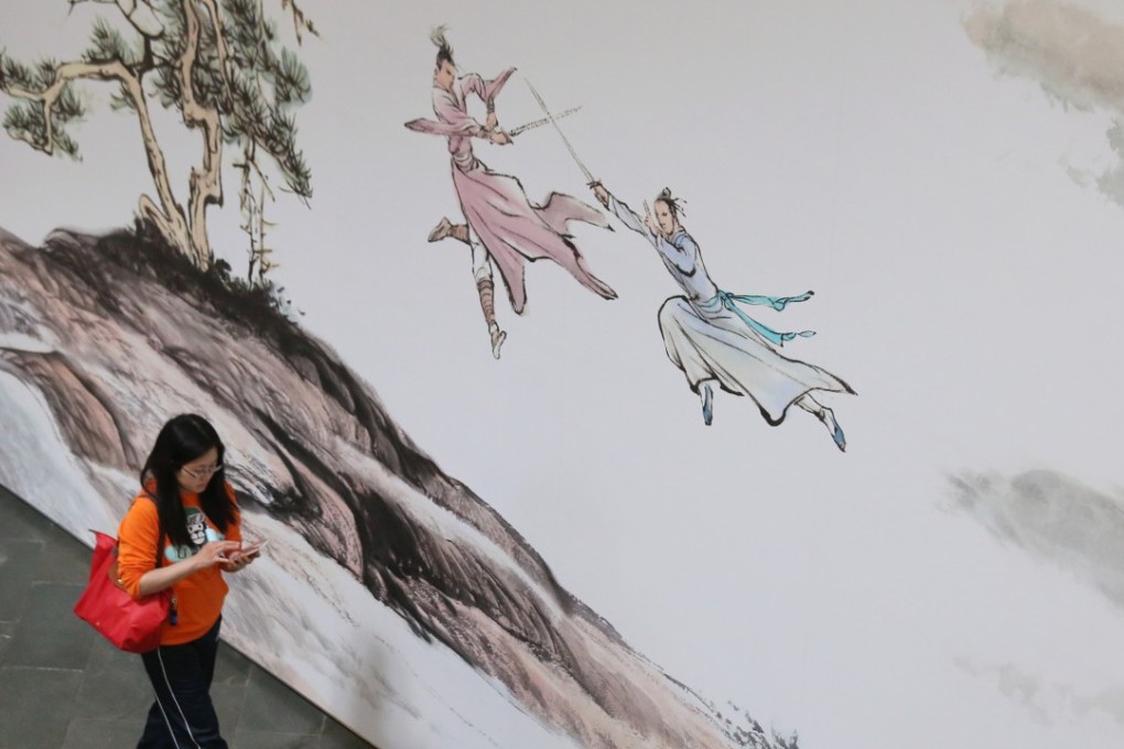 Visitors enjoy the exhibition of Jin Yong Gallery, a permanent exhibition, at the Hong Kong Heritage Museum in Sha Tin. Jin Yong (aka Louis Chia Leung-yung) is one of the renowned Chinese martial arts novel writer in the 20th century. 01MAR17 SCMP / Photo: K Y Cheng