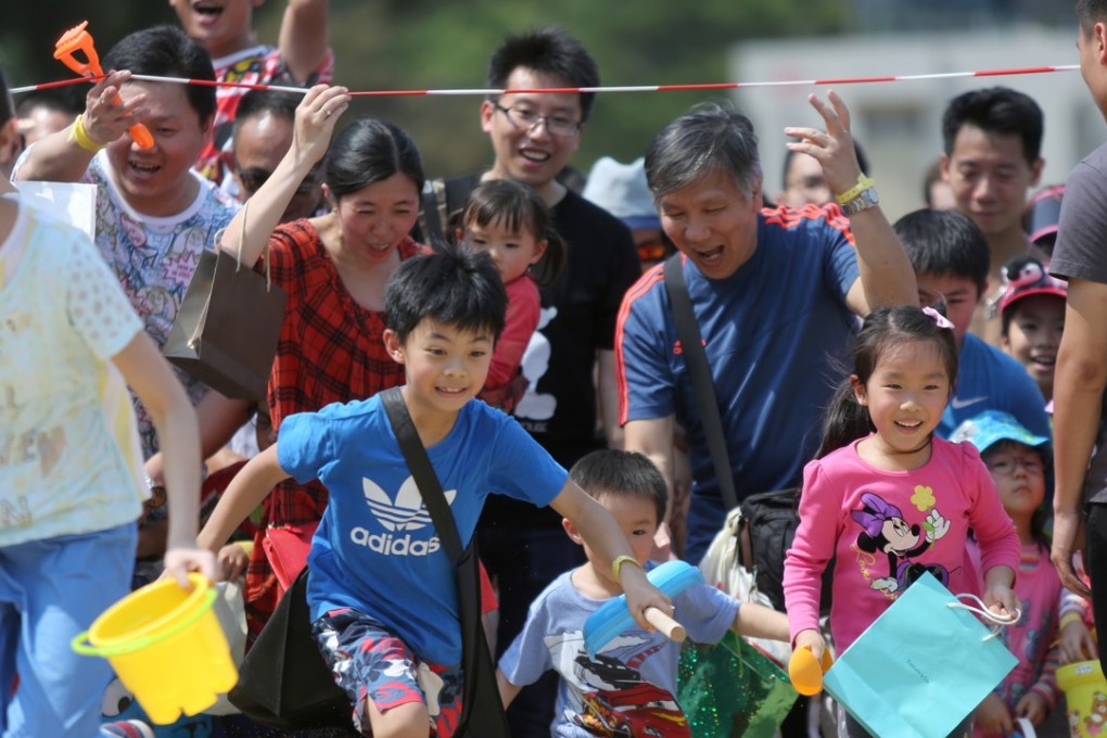Children rush to begin the Ma Wan Easter Egg Hunt, a charity campaign to raise funds for refugees and asylum seekers in Hong Kong, on April 15, 2017. Photo: Xiaomei Chen