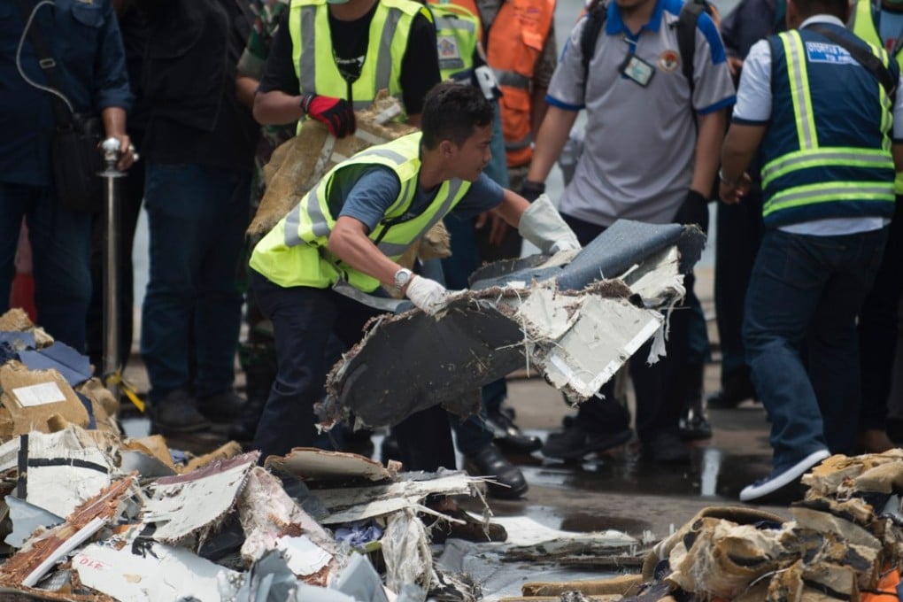 Boeing and US National Transportation Safety Board officials have joined the Indonesian team in sifting through twisted metal plane parts and piles of passengers’ torn clothing, shoes, wallets and phones. Photo: AFP