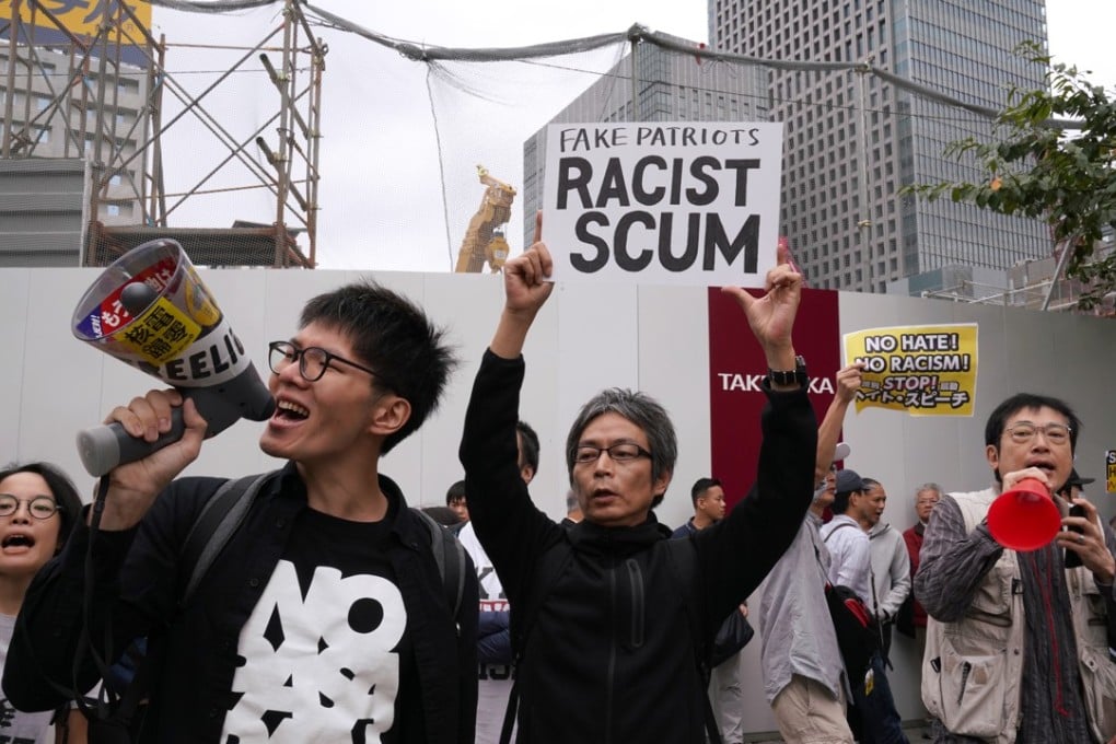Pro-immigrant demonstrators protest the new legislation at a rally in Tokyo in October. Photo: Bloomberg