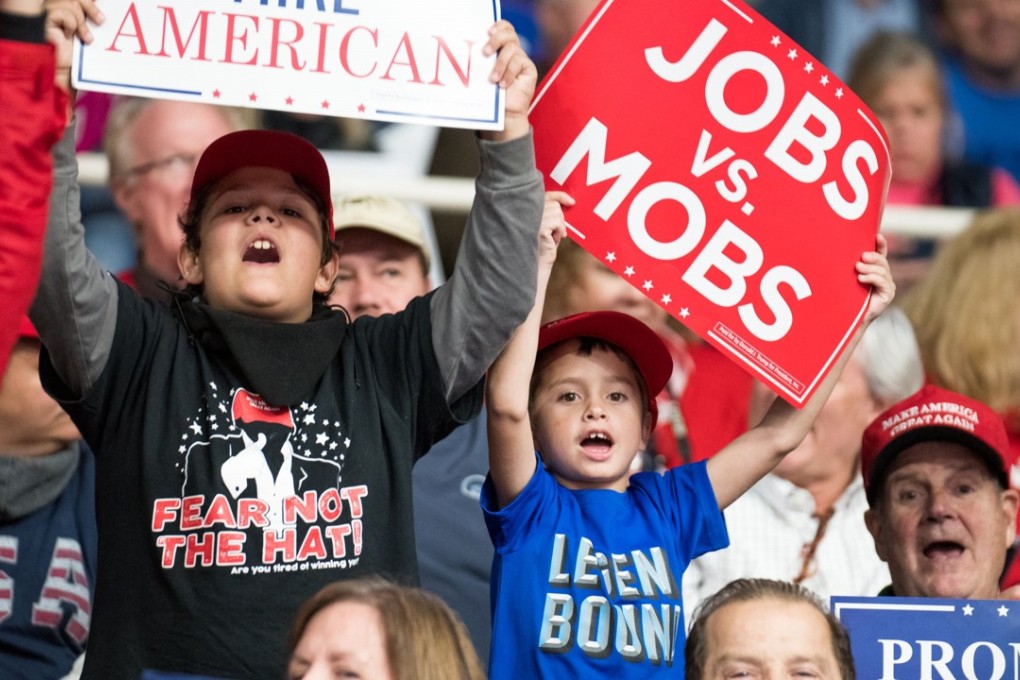 Supporters of President Donald Trump cheer while waiting for his arrival before a campaign rally at the Bojangles Coliseum in Charlotte, North Carolina. If voters endorse Trump in next week’s Senate and House of Representative elections, they are also endorsing his dangerous trade policies. Photo: AFP