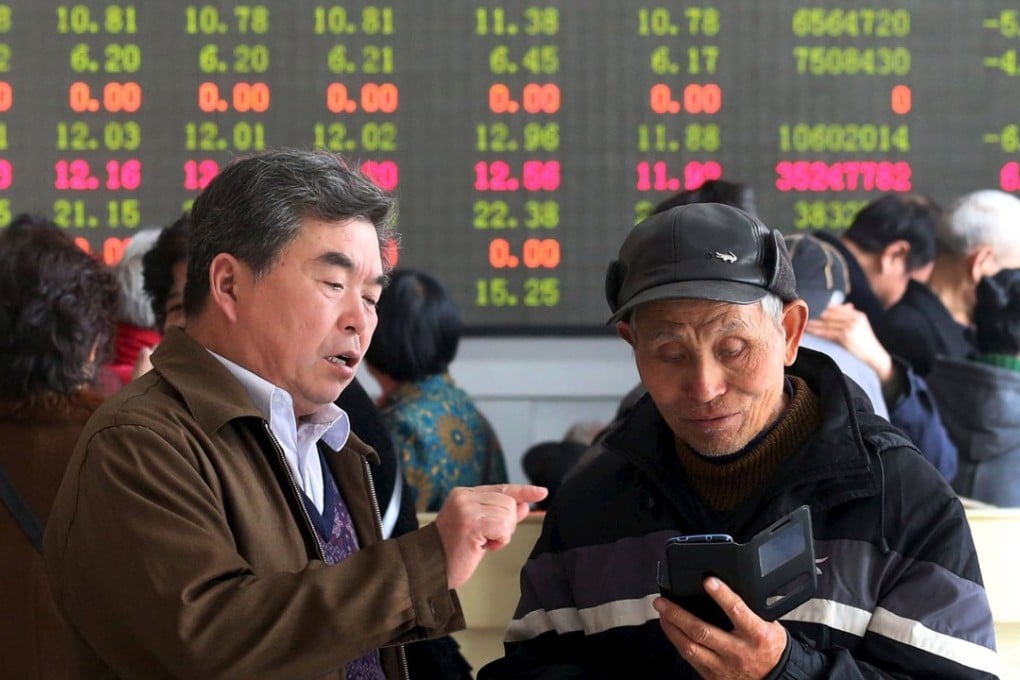 Investors talk at a brokerage house in Kaifeng, Henan province. Equities in emerging markets, including China, have become cheap this year. Photo: Reuters