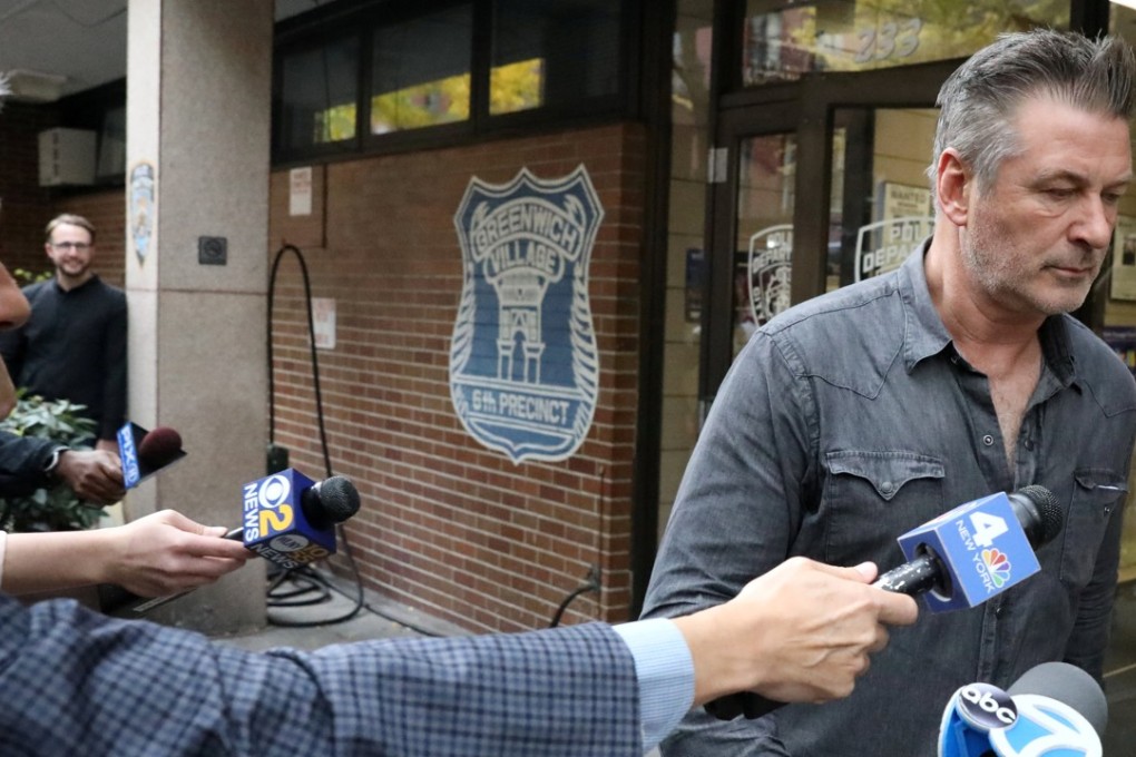 Actor Alec Baldwin exits the 6th precinct of the New York Police Department in Manhattan on Friday after being charged with assault and harassment. Photo: Reuters