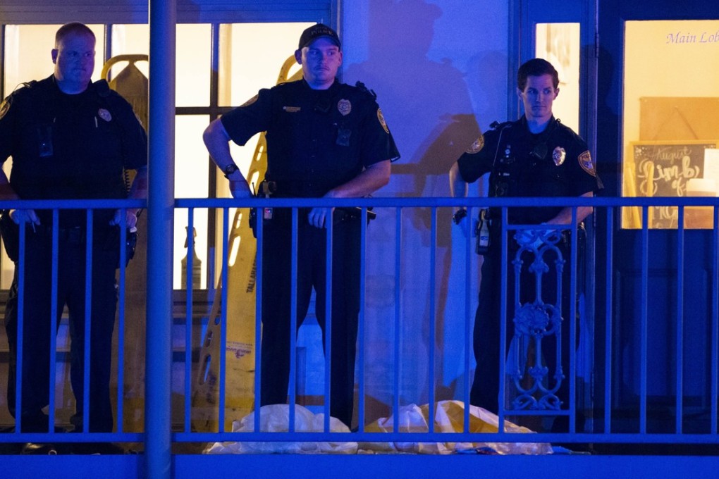 Police officers stand outside a yoga studio where a gunman killed one person and injured several others in Tallahassee, Florida on Friday. Photo: AFP