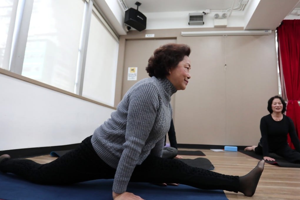 Leung Kit-luen, 64, participates in a yoga class in Yau Ma Tei. Photo: Jonathan Wong