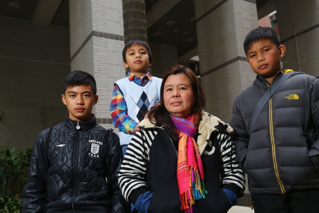 Desiree Rante Luis (centre), who may be separated from her sons (from left) David John, Mark Joelery and Carl Benz. Photo: Edmond So
