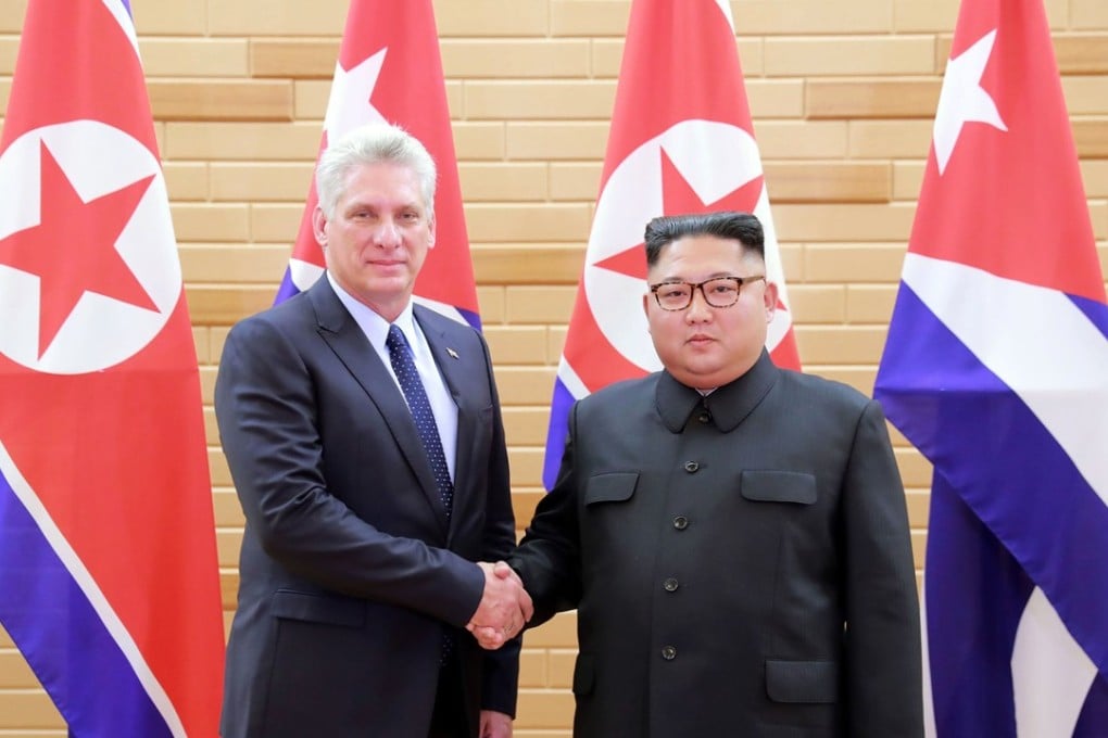 Cuban President Miguel Diaz-Canel and North Korean leader Kim Jong-un pose for a photo during a meeting in Pyongyang, North Korea, on Sunday. Photo: AP