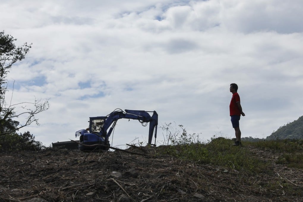 An excavator clears weeds ahead of work to revive areas of the Sha Lo Tung valley. Photo: Nora Tam