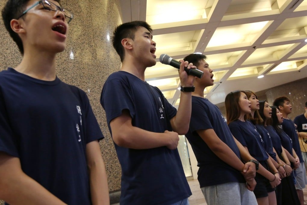Students from Baptist University sing in memory of the Tiananmen Square protests of June 4, 1989, in Causeway Bay this year. Hongkongers continue to commemorate the events surrounding the crackdown each June, though discussion of the event is censored in mainland China. Photo: Robert Ng