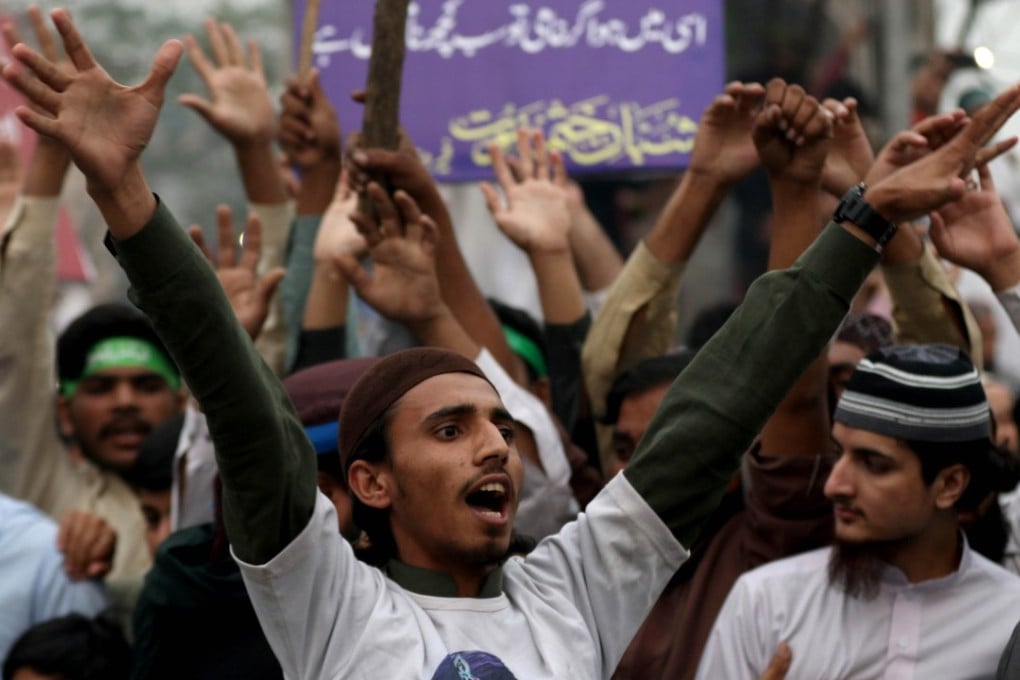 Supporters of the radical Tehreek-e-Labbaik Pakistan (TLP) party rally against the Pakistan Supreme Court’s acquittal of Asia Bibi, at a rally in Lahore last Friday, one of a number of protests that paralysed major cities. Photo: AP