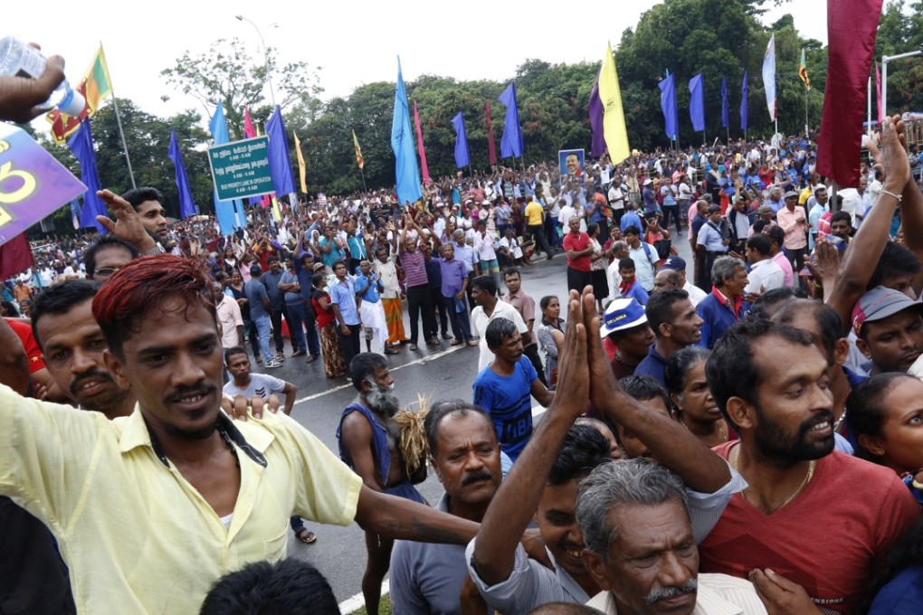 Government supporters take part in a solidarity rally in Colombo on November 5. Photo: EPA