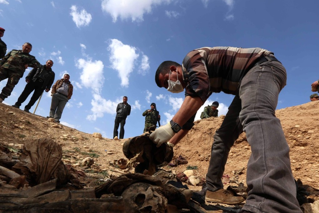 Members of the Yazidi minority search for clues, that might lead them to missing relatives. File photo: AFP