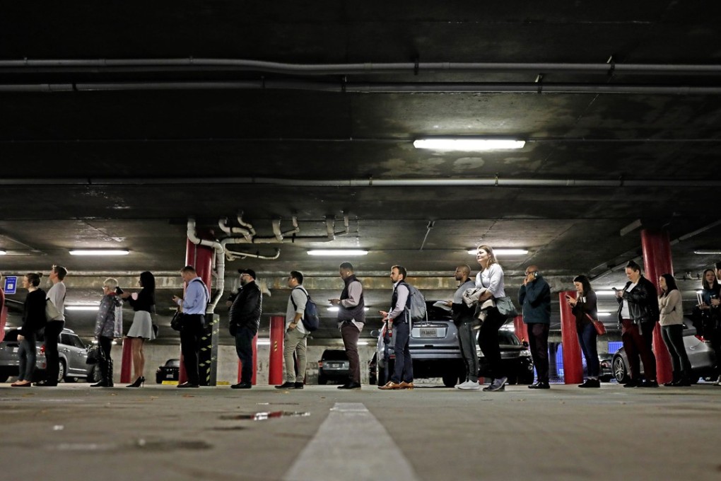 A line backs up into a parking garage outside a polling site on election day in Atlanta on Tuesday. Photo: AP