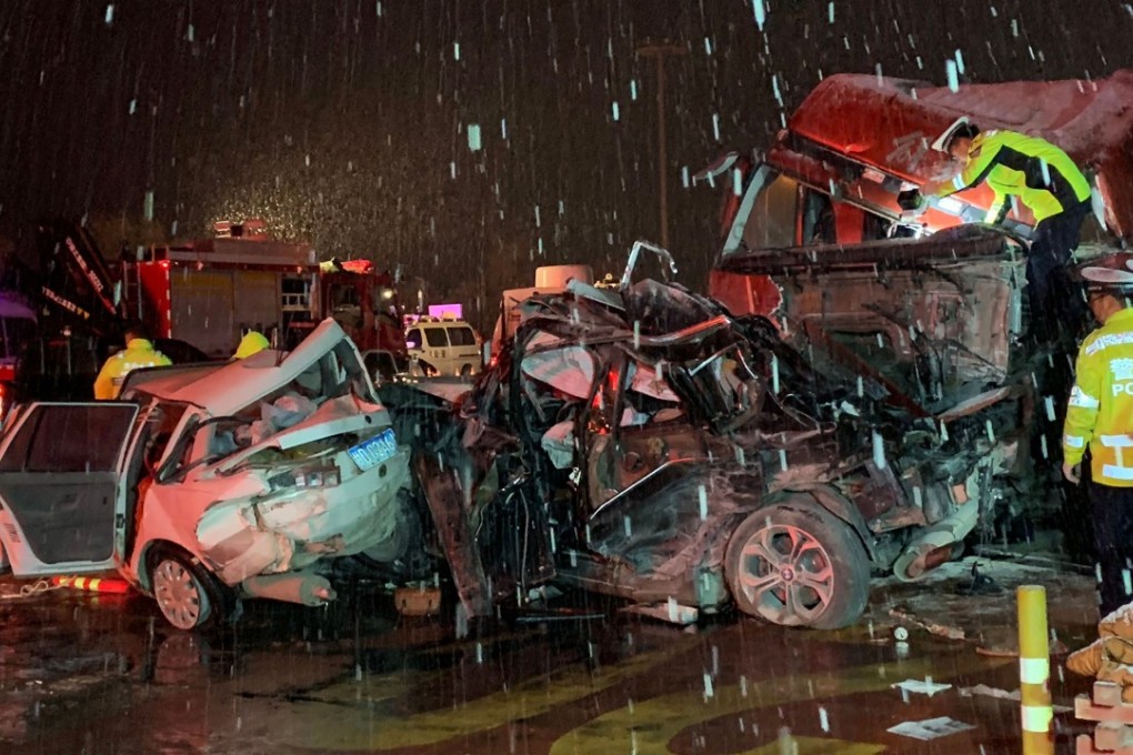 Chinese police officers and rescuers work at the site of where an out-of-control truck ploughed into a 31-car line-up in northwest China’s Gansu province, killing 15 people. Photo: AFP