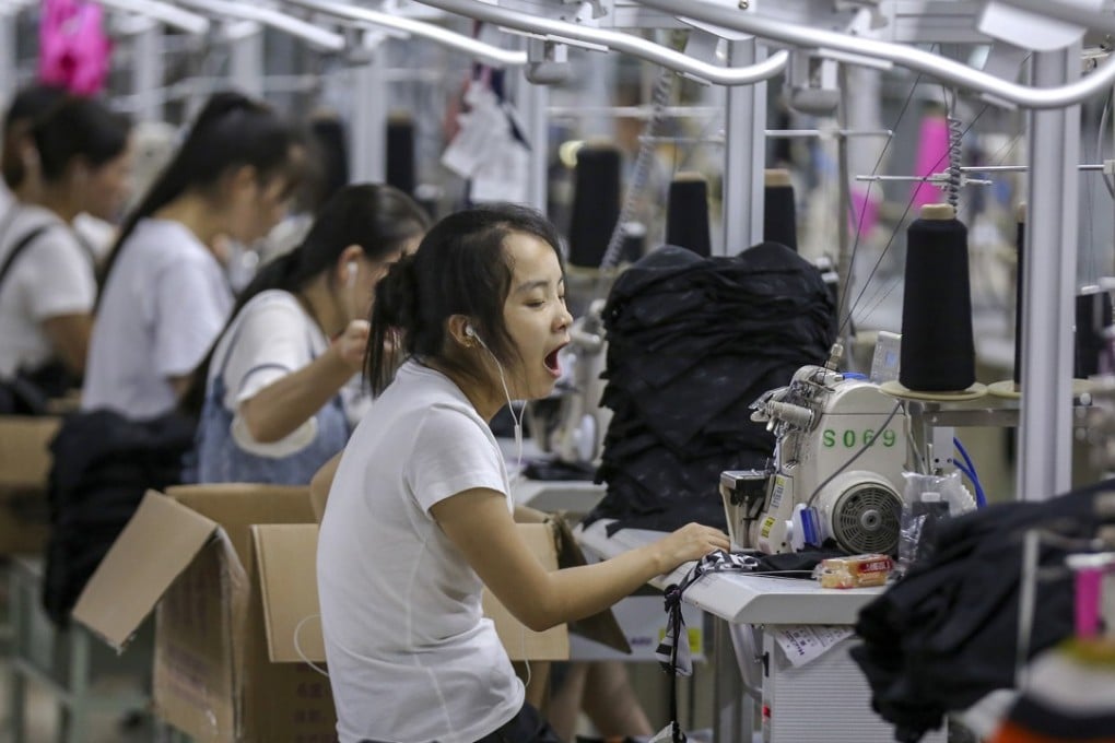 A woman yawns at a factory making swimsuits in Jinjiang in southeast China’s Fujian province in August. In recent months, Chinese exporters accelerated production and shipment to avoid the upcoming tariff increases. Photo: AP