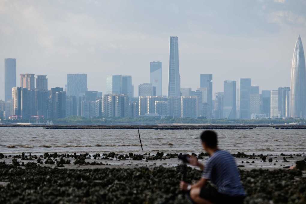 A man in Hong Kong looks across Deep Bay, at Shenzhen’s skyline. Photo: AFP