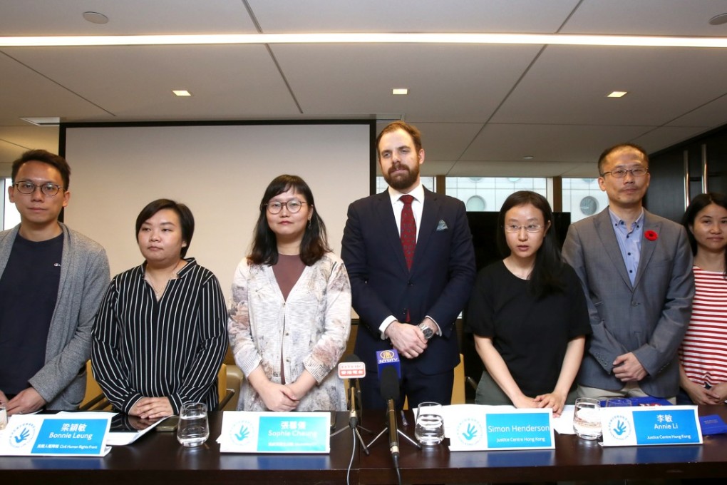 Members of the United Periodic Review Coalition including Bonnie Leung of Civil Human Rights Front (second left) and Simon Henderson (centre) in Central. Photo: Jonathan Wong