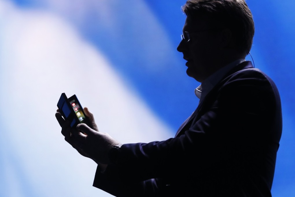 Justin Denison, Samsung Electronics senior vice-president of Mobile Product Marketing, unfolds Samsung's new foldable screen smartphone, during the Samsung Developers Conference in San Francisco on Wednesday. Photo: Reuters