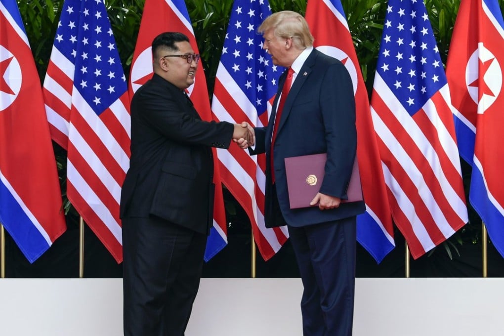 North Korea leader Kim Jong-un (left) and US President Donald Trump shake hands after their meetings on Sentosa Island in Singapore on June 12. Photo: AFP