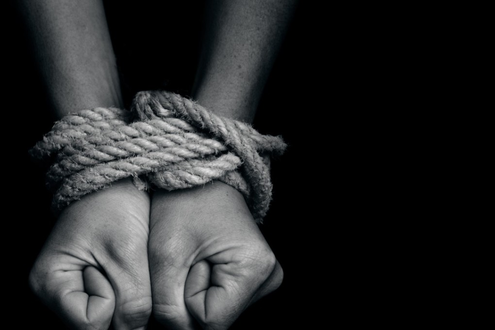 The labourer claims he endured 12-hour working days in unsafe conditions and had much of his earnings seized