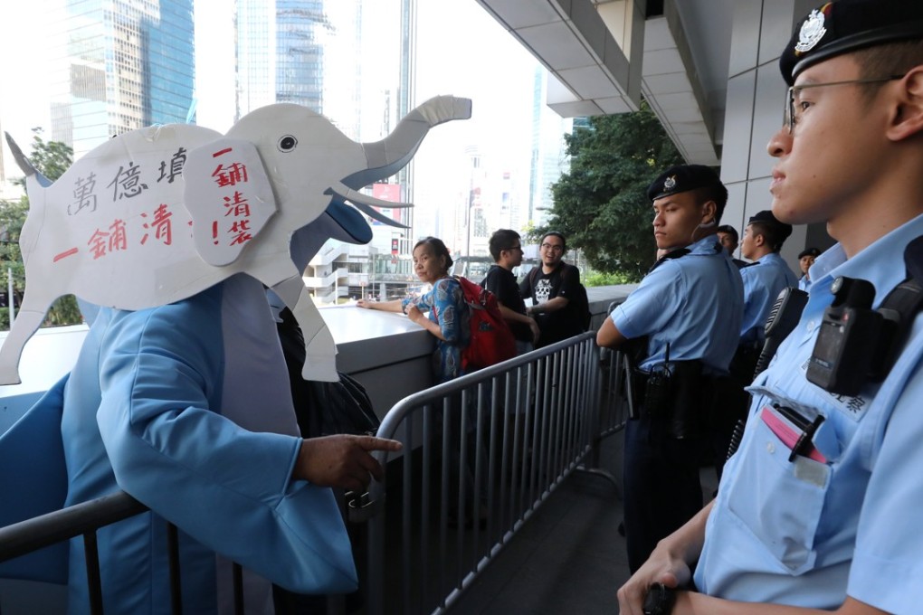 A protester dressed as a white elephant in protest against the Lantau Island reclamation scheme at government headquarters in Admiralty. Photo: Felix Wong