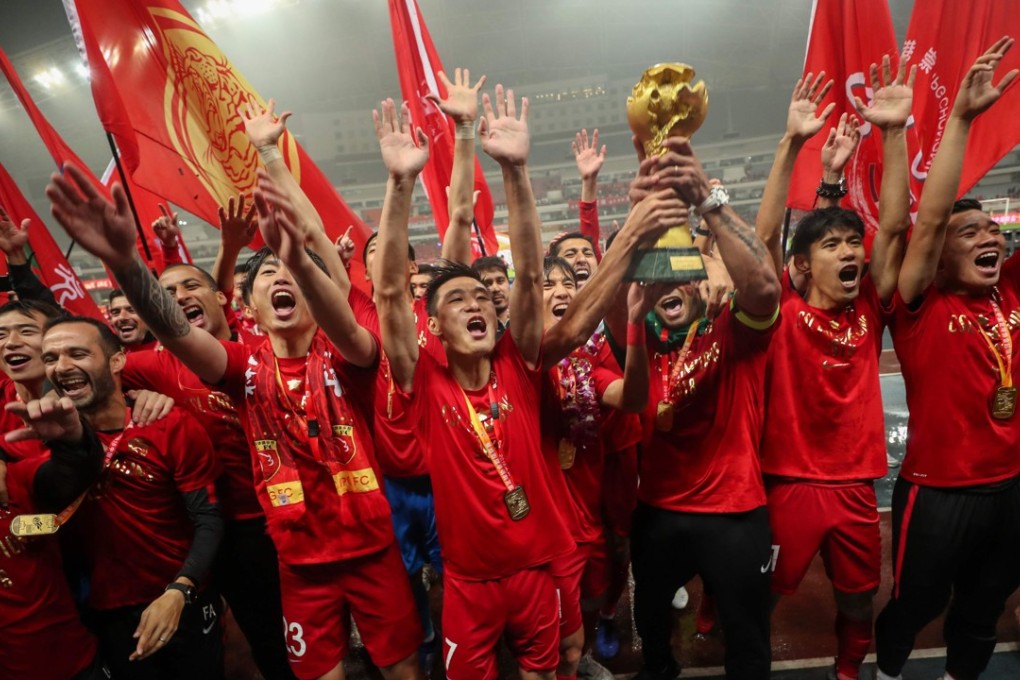Shanghai SIPG celebrate winning the Chinese Super League after beating Beijing Renhe at Shanghai Stadium on Wednesday night. Photo: AFP