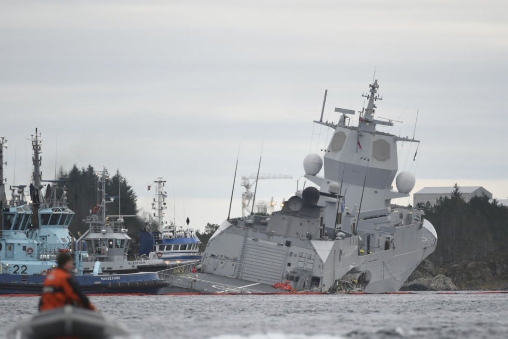 The Norwegian frigate KNM Helge Ingstad, right, after a collision with the tanker Sola TS. Photo: AP