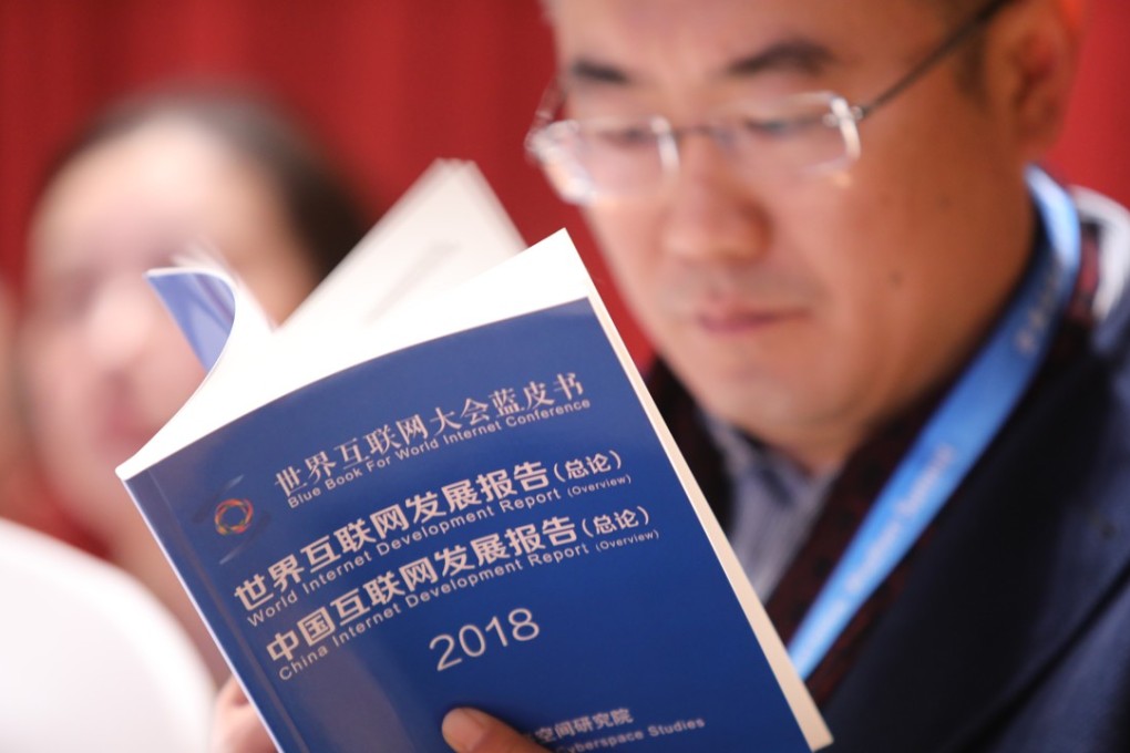 A man reads the general introduction to the 2018 World Internet Development Report and 2018 China Internet Development Report. Photo: Simon Song