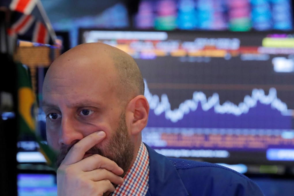 A trader works on the floor of the New York Stock Exchange. Wall Street’s October sell-off has pared gains for the year for the S&P and Nasdaq Composite indices. Photo: Reuters