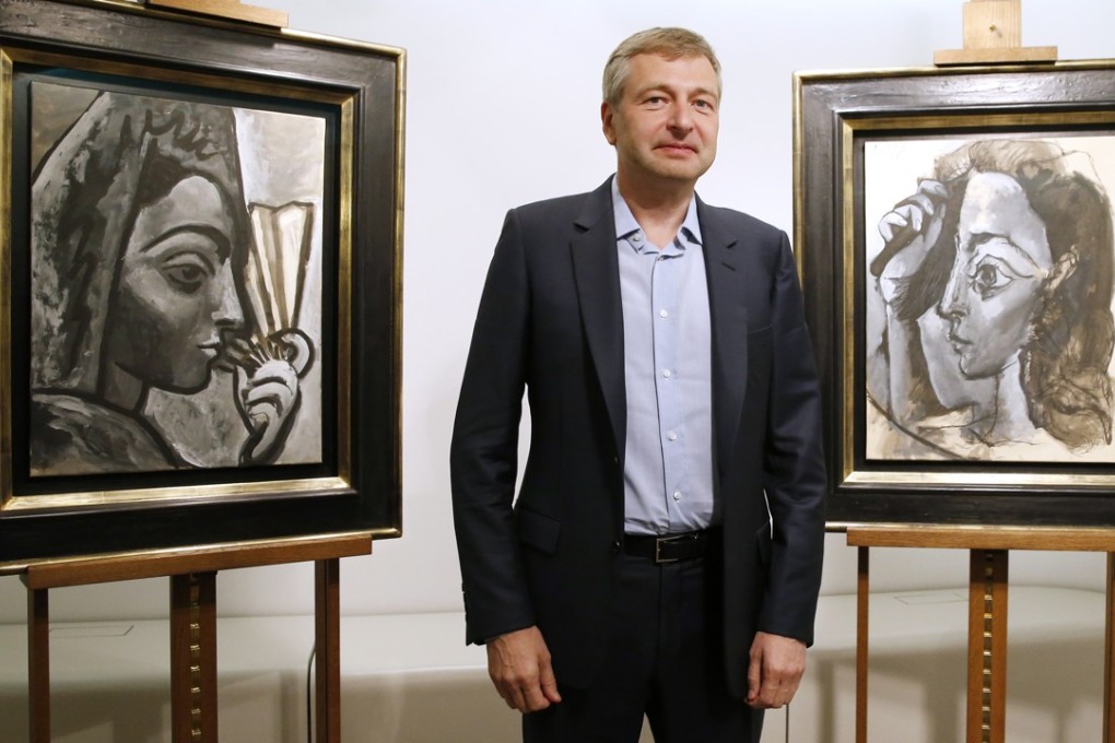 Russian businessman and president of AS Monaco football club Dmitry Rybolovlev in front of two allegedly stolen paintings by Pablo Picasso. Photo: AFP