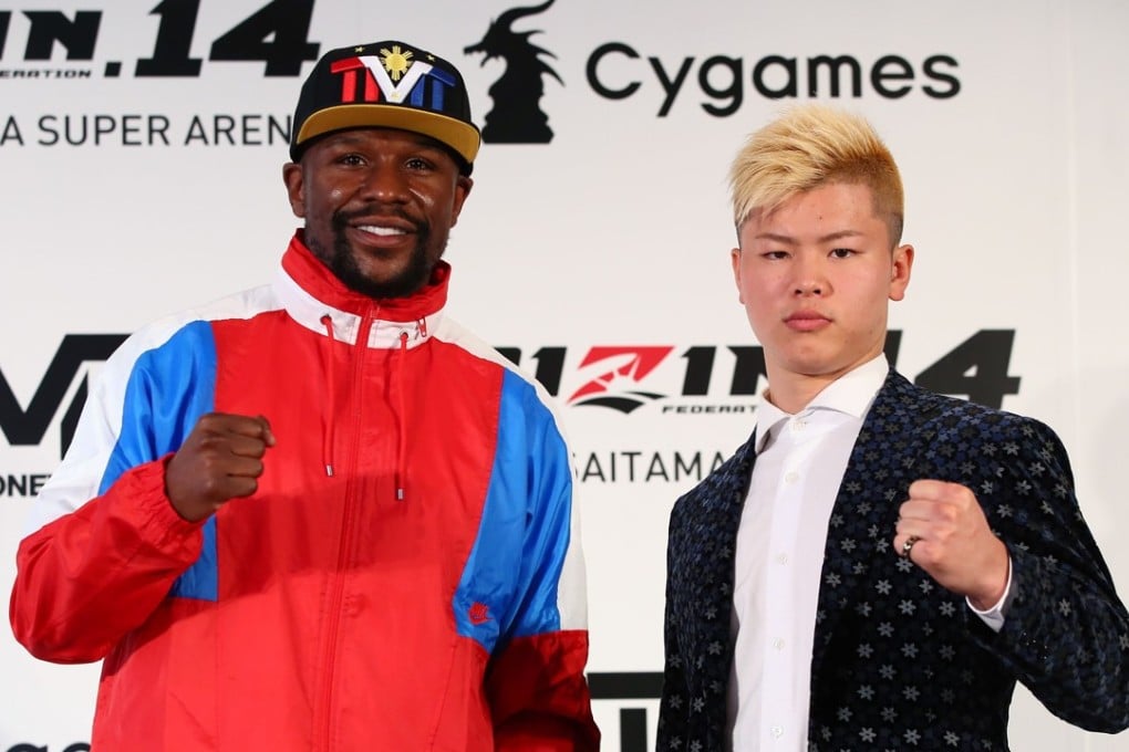 Floyd Mayweather (left) poses with Japanese kick-boxer Tenshin Nasukawa during a press conference to announce their fight. Photo: AFP