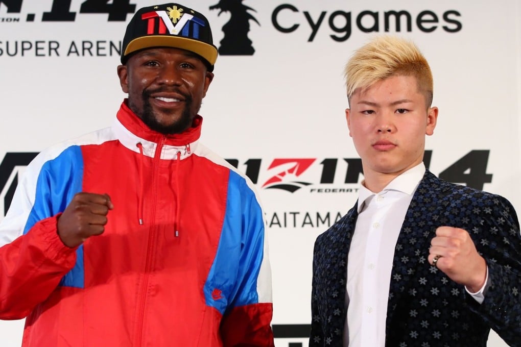 Floyd Mayweather (left) poses with Japanese kick-boxer Tenshin Nasukawa during a press conference to announce their fight. Photo: AFP