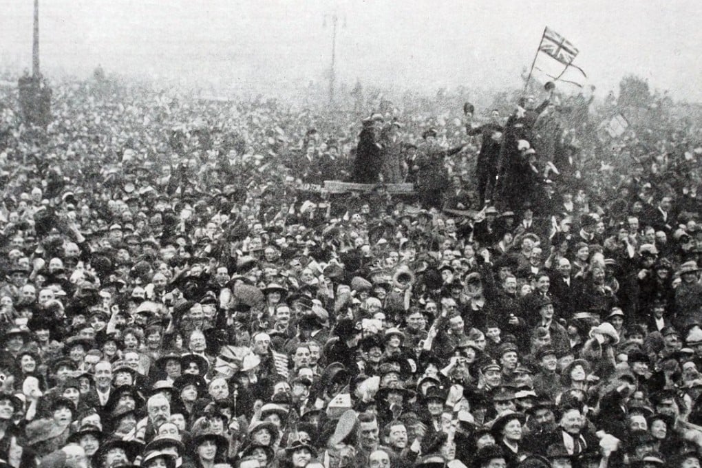 A crowd gathers outside Buckingham Palace to celebrate the end of the war, on November 11, 1918. Picture: Alamy