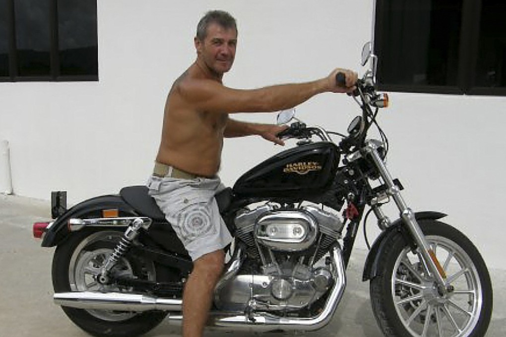John Jones on his Harley-Davidson motorcycle in a picture he posted on Facebook from Langkawi with the caption “Much better when it is moving in the sun shine”. Picture: Red Door News