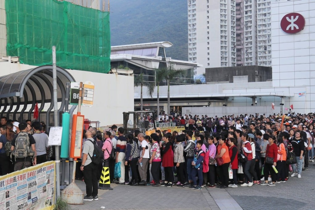 Mainland tourists wait for the bus at Tung Chung MTR station. Photo: SCMP Pictures