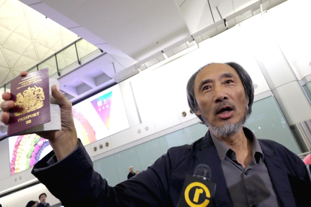 Chinese dissident writer Ma Jian holds up his British passport after arriving at Hong Kong International Airport on Friday. Photo: Dickson Lee