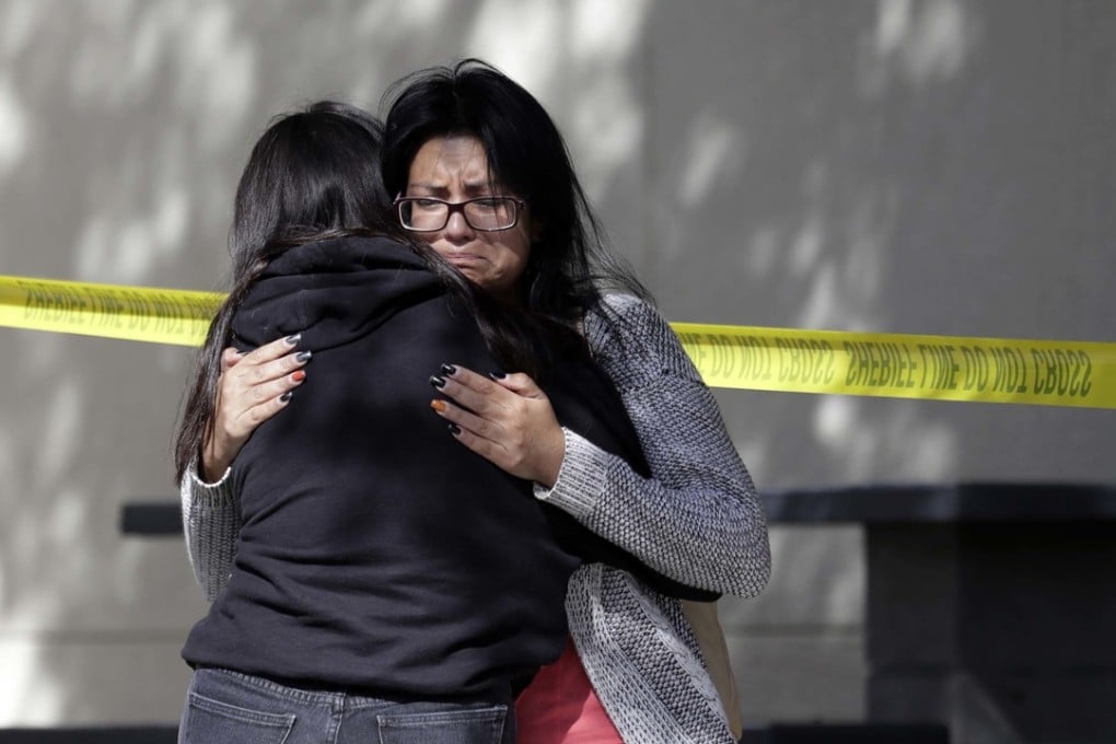 Mourners react outside a reception centre for families of victims of a mass shooting in Thousand Oaks, California, on Thursday. Photo: AP