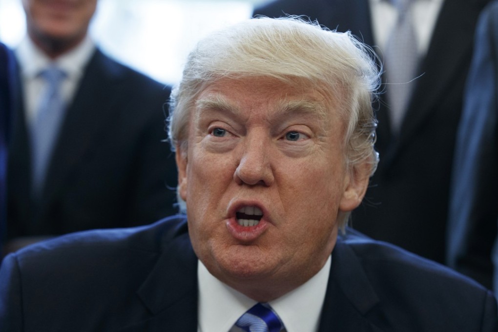 In a Friday, March 24, 2017 file photo, President Donald Trump announces the approval of a permit to build the Keystone XL pipeline in the Oval Office of the White House. Photo: AP Photo