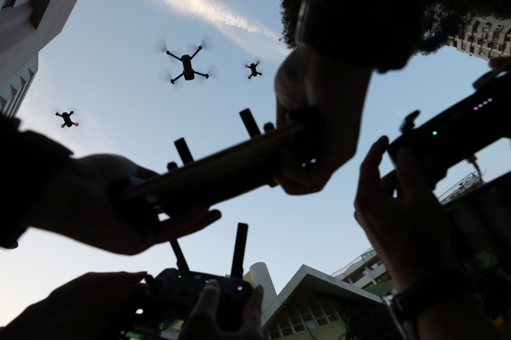 Three DJI drones being flown via remote control over Morrison Hill Road in Causeway Bay, Hong Kong. Photo: Winson Wong