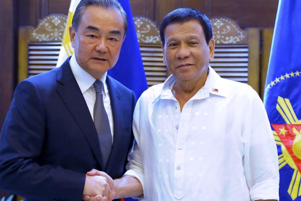 Chinese Foreign Minister Wang Yi and Philippine President Rodrigo Duterte in Davao city, southern Philippines. Photo: EPA