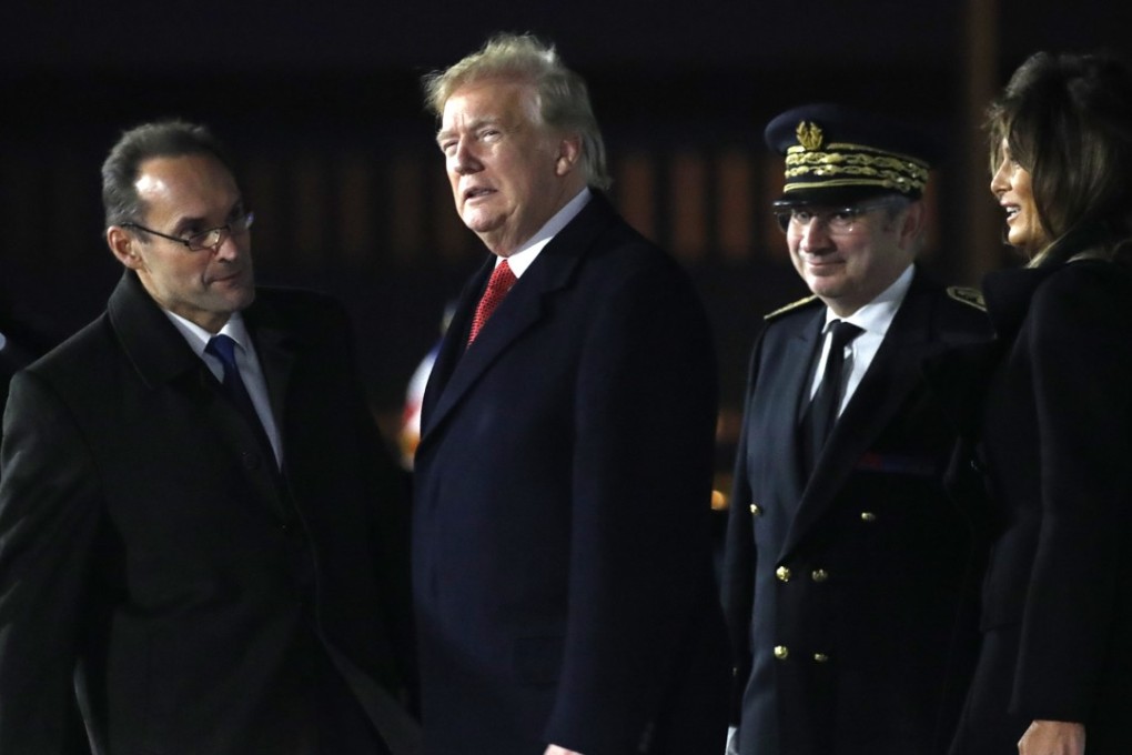 US President Donald Trump and first lady Melania Trump are greeted after arriving on Air Force One at Orly airport near Paris. Photo: AP