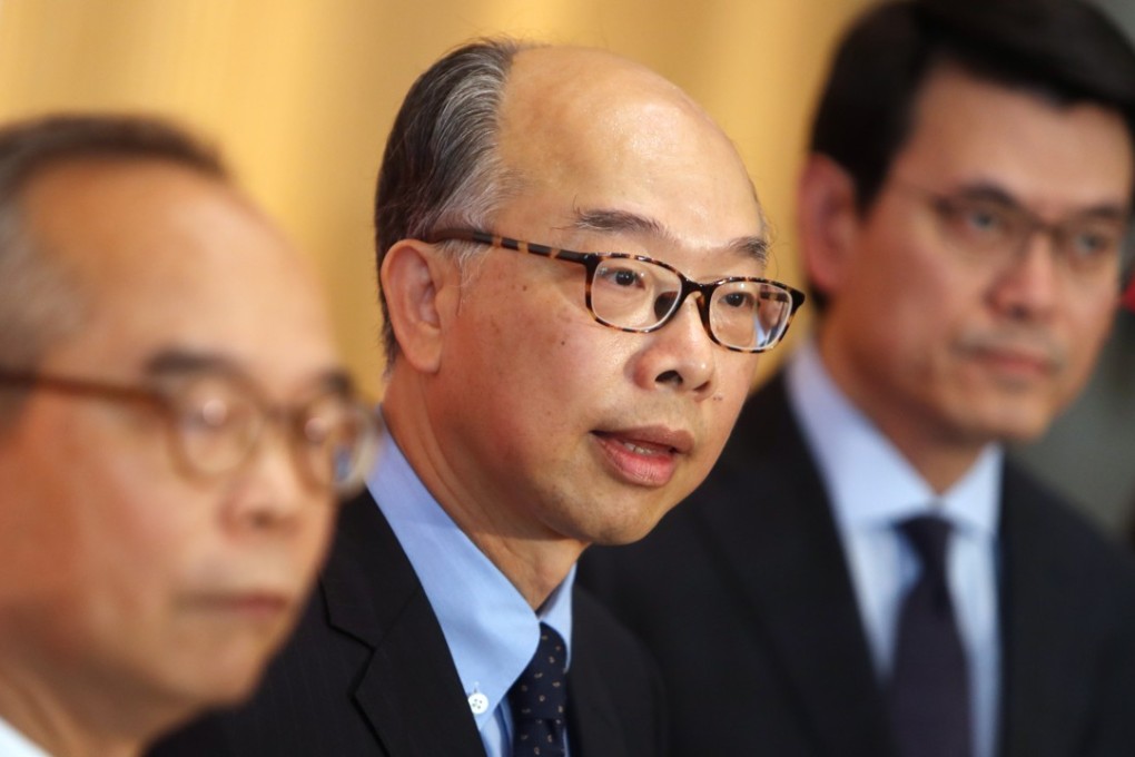 (From left) Lau Kong-wah, Frank Chan and Commerce Secretary Edward Yau Tang-wah announce the measures. Photo: Winson Wong